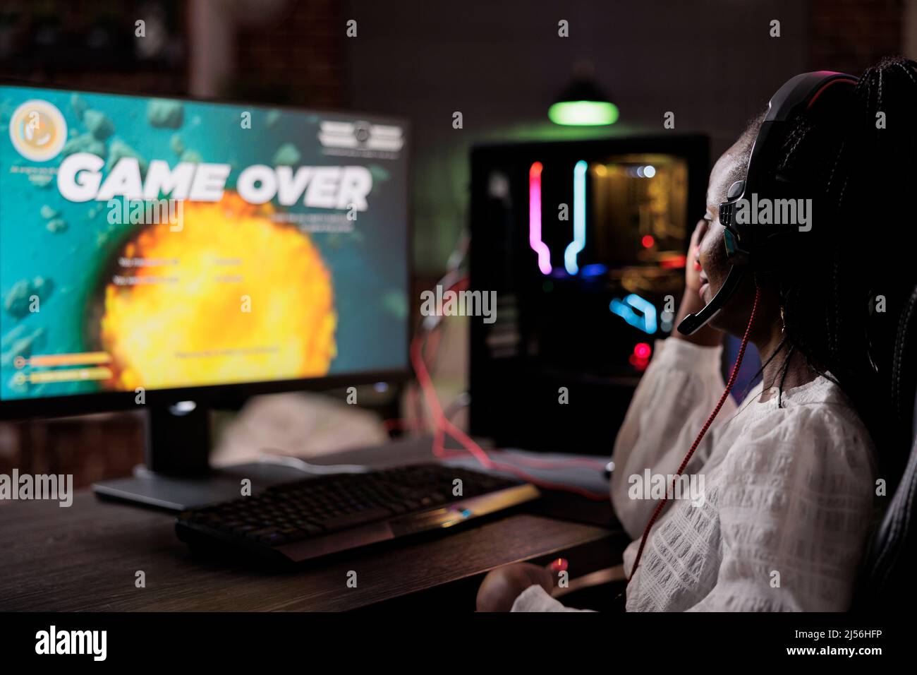 Frustrated streamer losing action video games competition play, using pc to stream gaming tournament. Female gamer feeling sad about lost online rpg multiplayer gameplay championship. Stock Photo