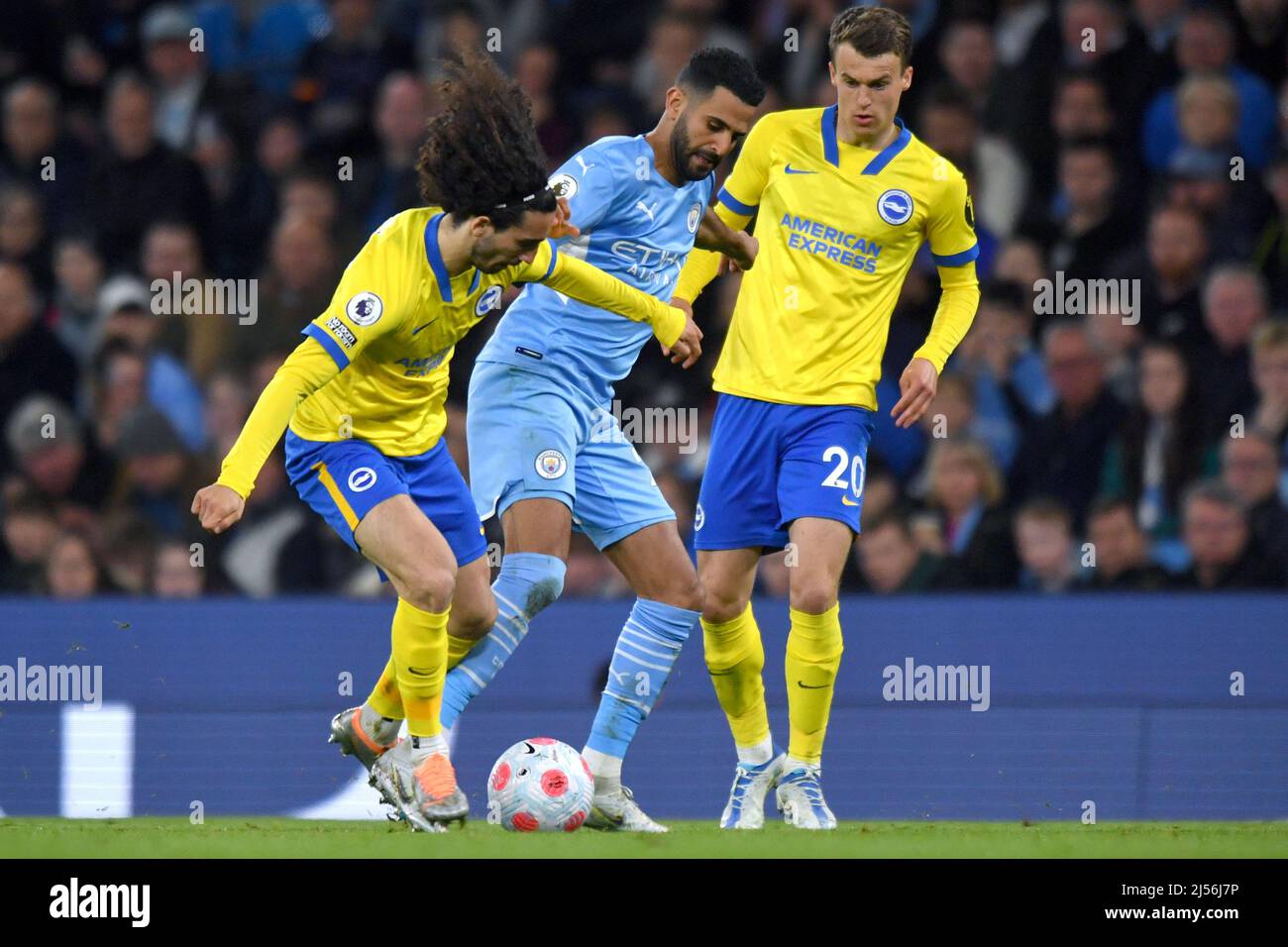 Manchester, UK, 20 April 2022,  Manchester City's Riyad Mahrez. Brighton and Hove Albion's Gaetan Bong and Brighton and Hove Albion's Solly March compete for possession. Picture date: Thursday April 21, 2022. Photo credit should read:  Anthony Devlin/Alamy Live News Stock Photo