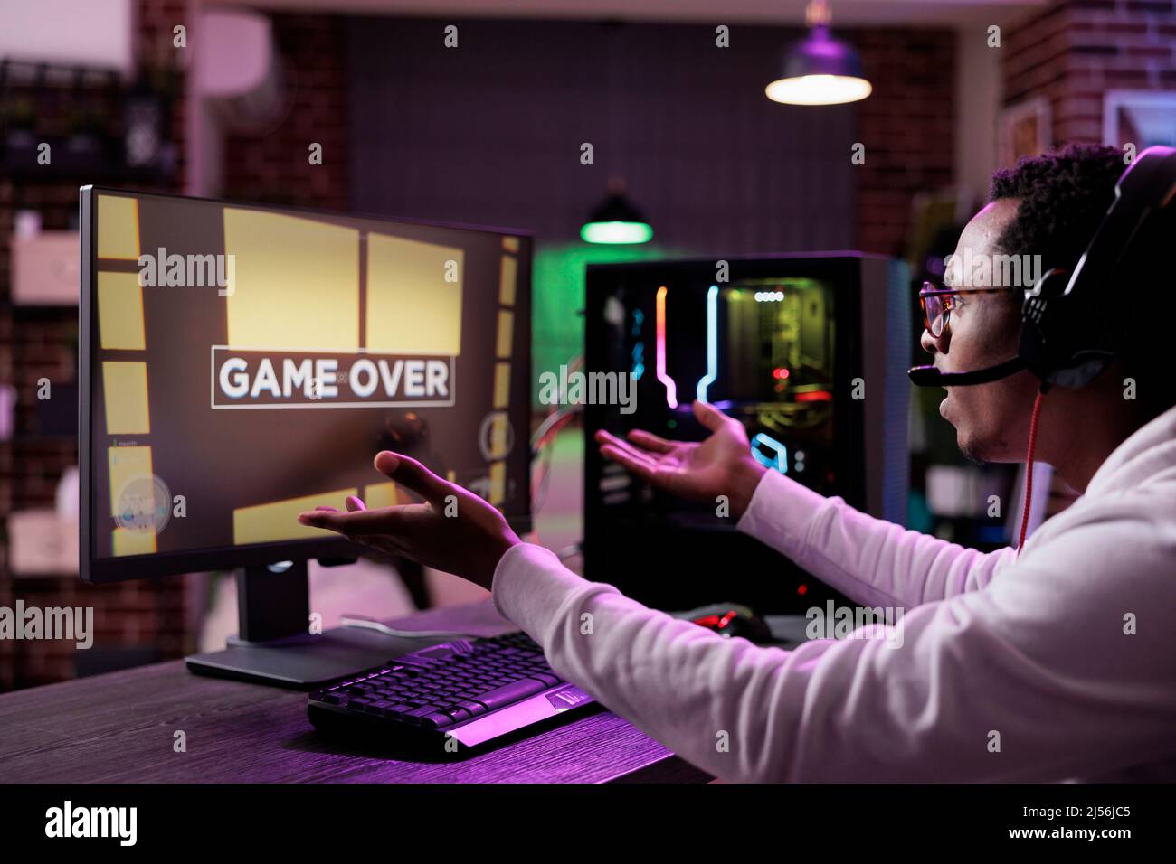 Premium Photo  Man feeling disapointed about losing video games on  computer. gamer with headphones using controller and playing online games  on monitor. sad player lost cyber game competition.