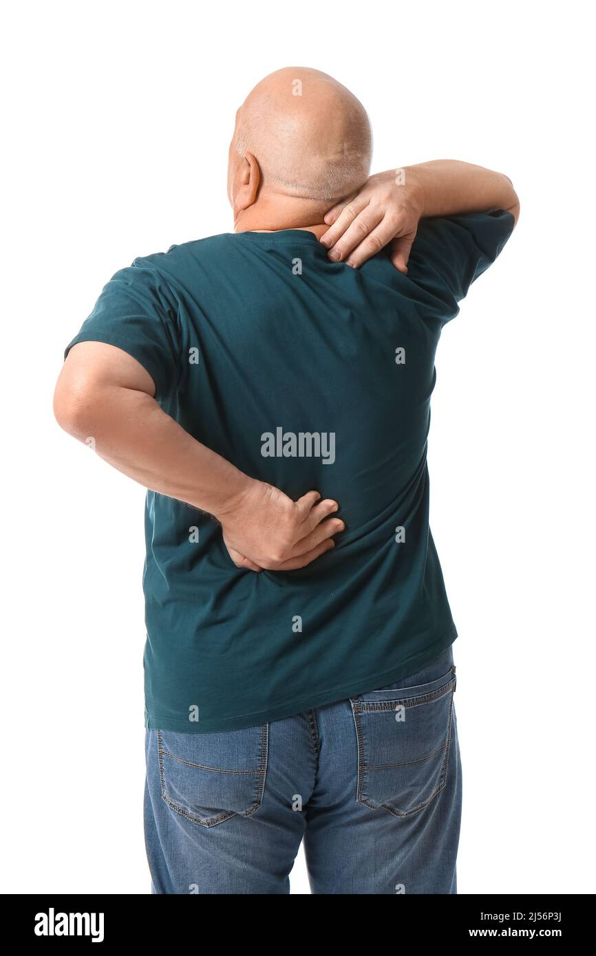 Senior man suffering from back pain on white background Stock Photo - Alamy