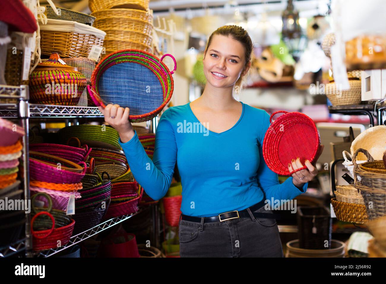 Female teen choosing colour wicker basket Stock Photo Alamy
