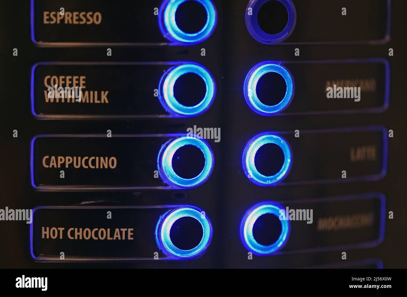 Buttons on a coffee machine indicating the type of drink glow blue