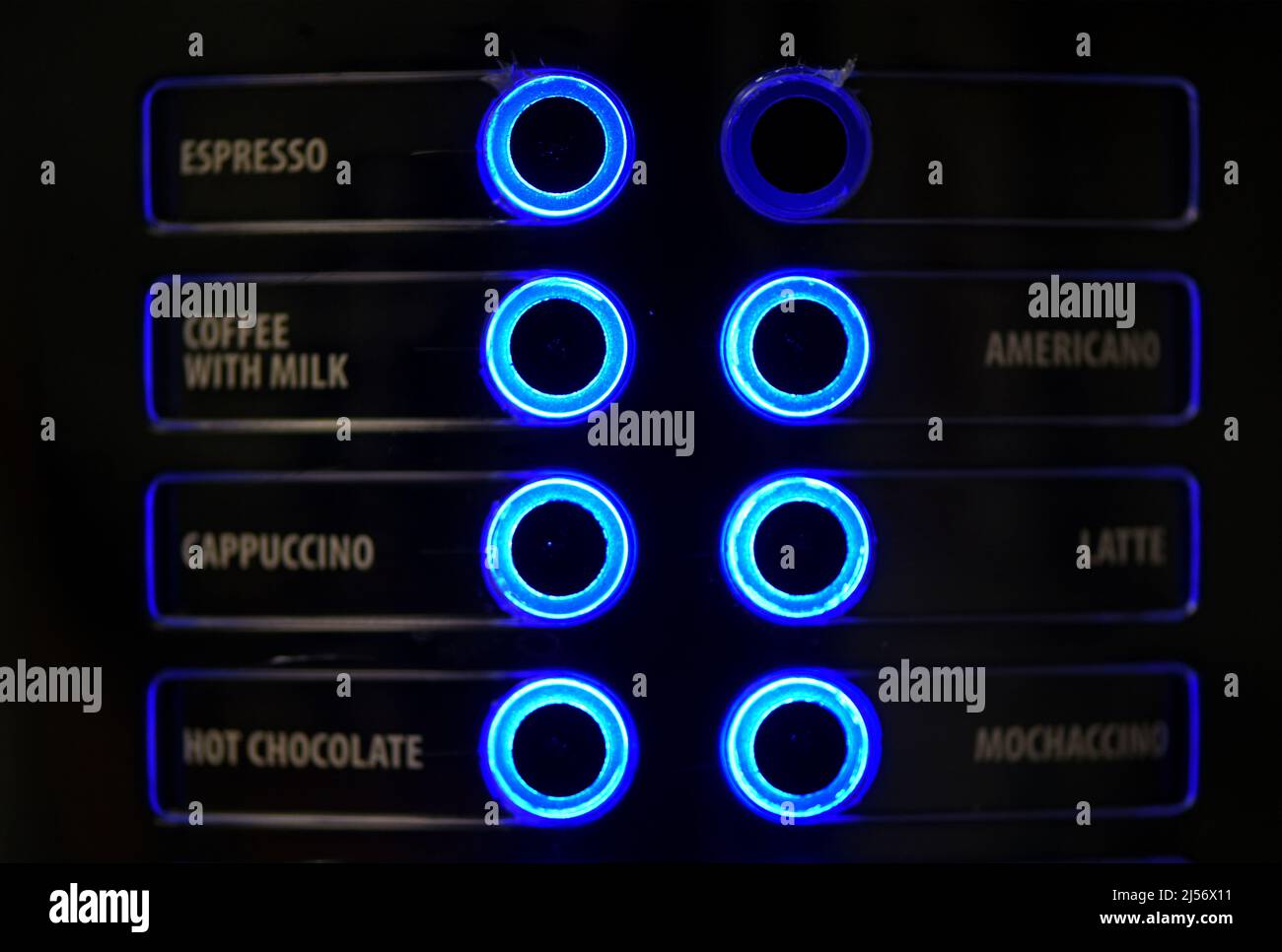 Buttons on a coffee machine indicating the type of drink glow blue