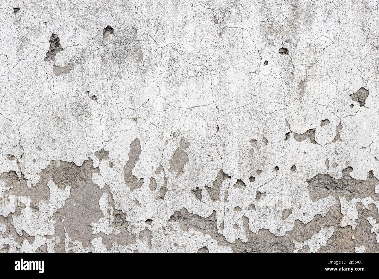 Old damaged concrete wall with cracks and grunge textures Stock Photo