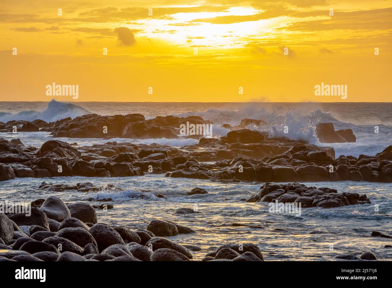 Heavy wave crashing on the rocky beach of Albion due to tropical cyclone Batsirai, west of Mauritius. Stock Photo