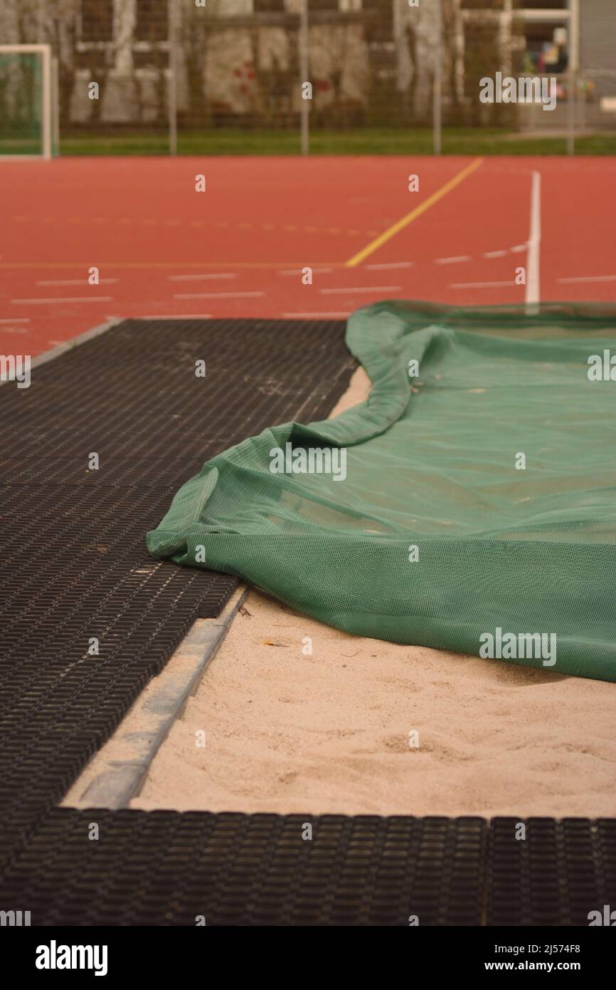 Track and Field Long Jump Sand Pit prepared for being used Stock Photo