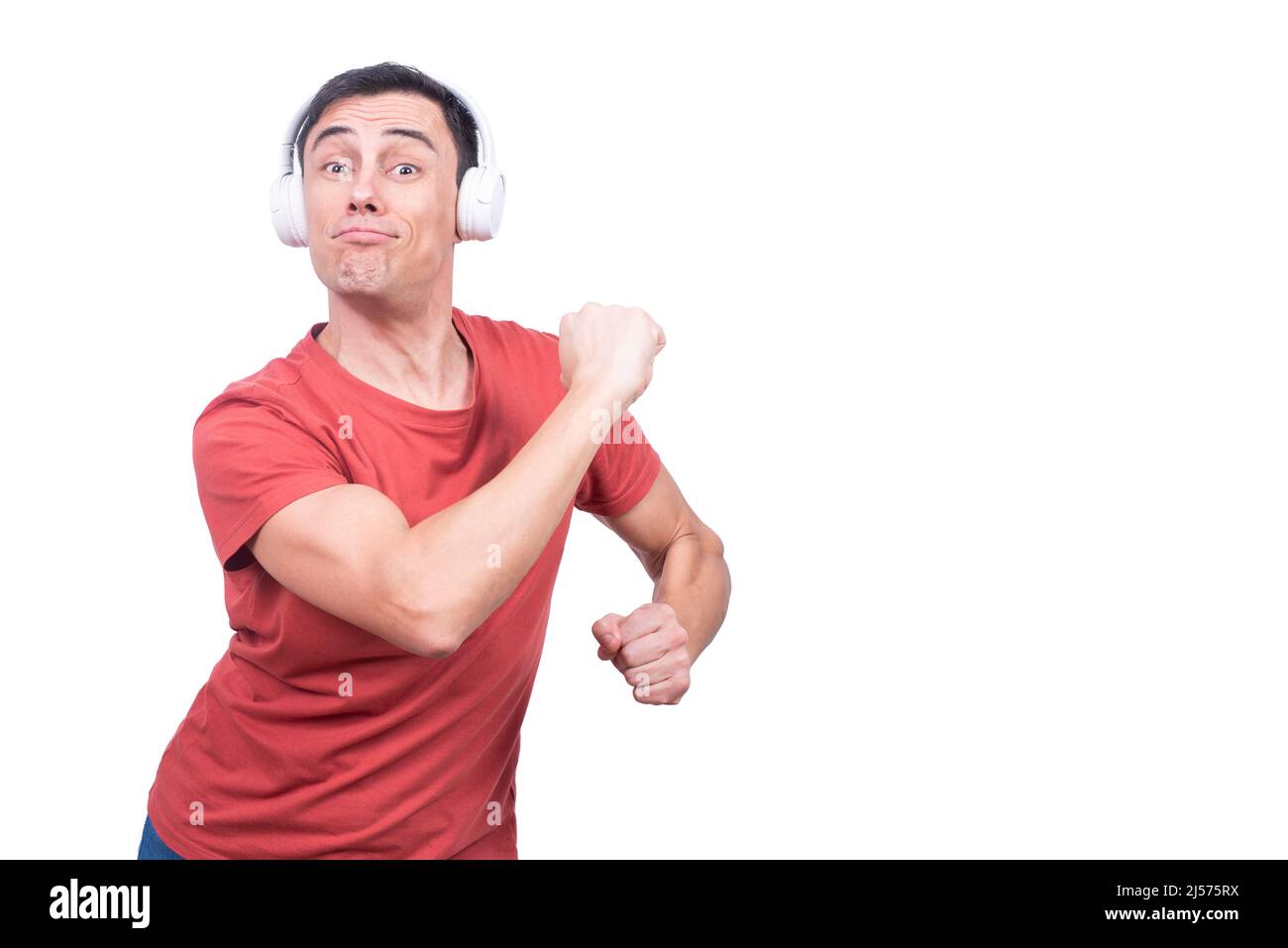 Delightful guy in headphones dancing in studio Stock Photo