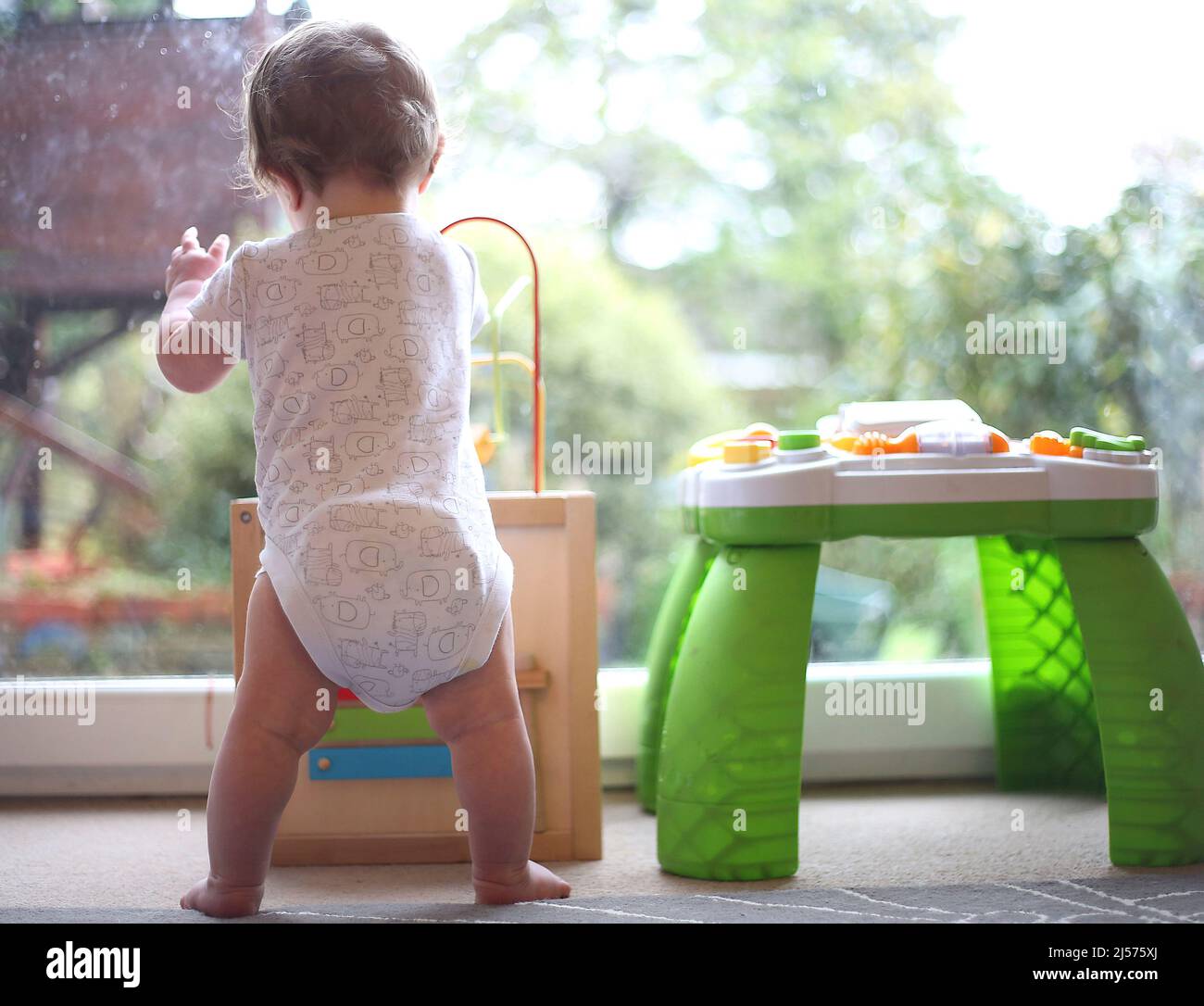 File photo dated 05/02/16 of an eight month old baby boy playing with an activity table. Around two-fifths of families with children at home were already struggling to pay their bills in early April as the cost-of-living crisis deepened, a survey has found. Issue date: Thursday April 21, 2022. Stock Photo