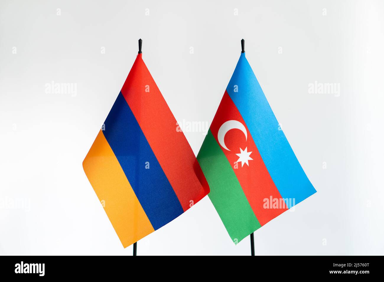 State flags of Azerbaijan and Armenia on light background. Karabakh conflict concept Stock Photo