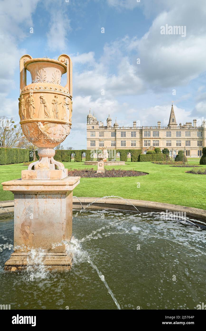 Roman Greek pot in a fountain of the south garden at Burleigh House, an elizabethan mansion owned by the Cecil family at Stamford, England. Stock Photo