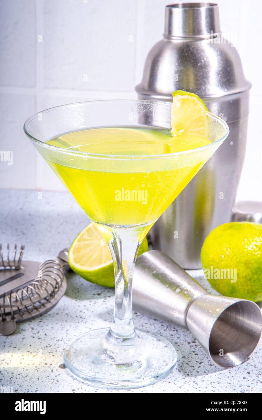 Classic Lime Daiquiri Martini Cocktail with Garnish. Green liqueur alcohol drink with bar
