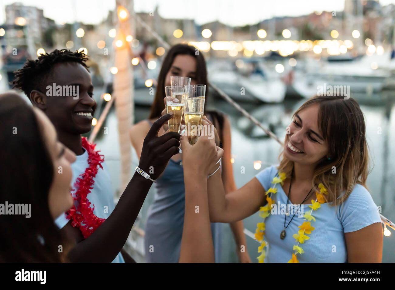 Group of multiracial friends having fun on boat party in summer vacation Stock Photo
