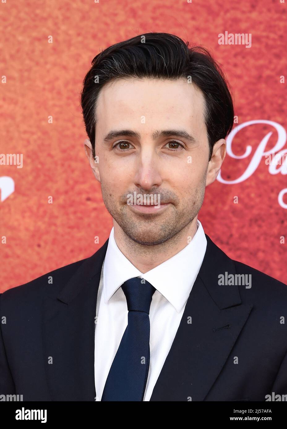 Josh Zuckerman walking on the red carpet at the Los Angeles Premiere of