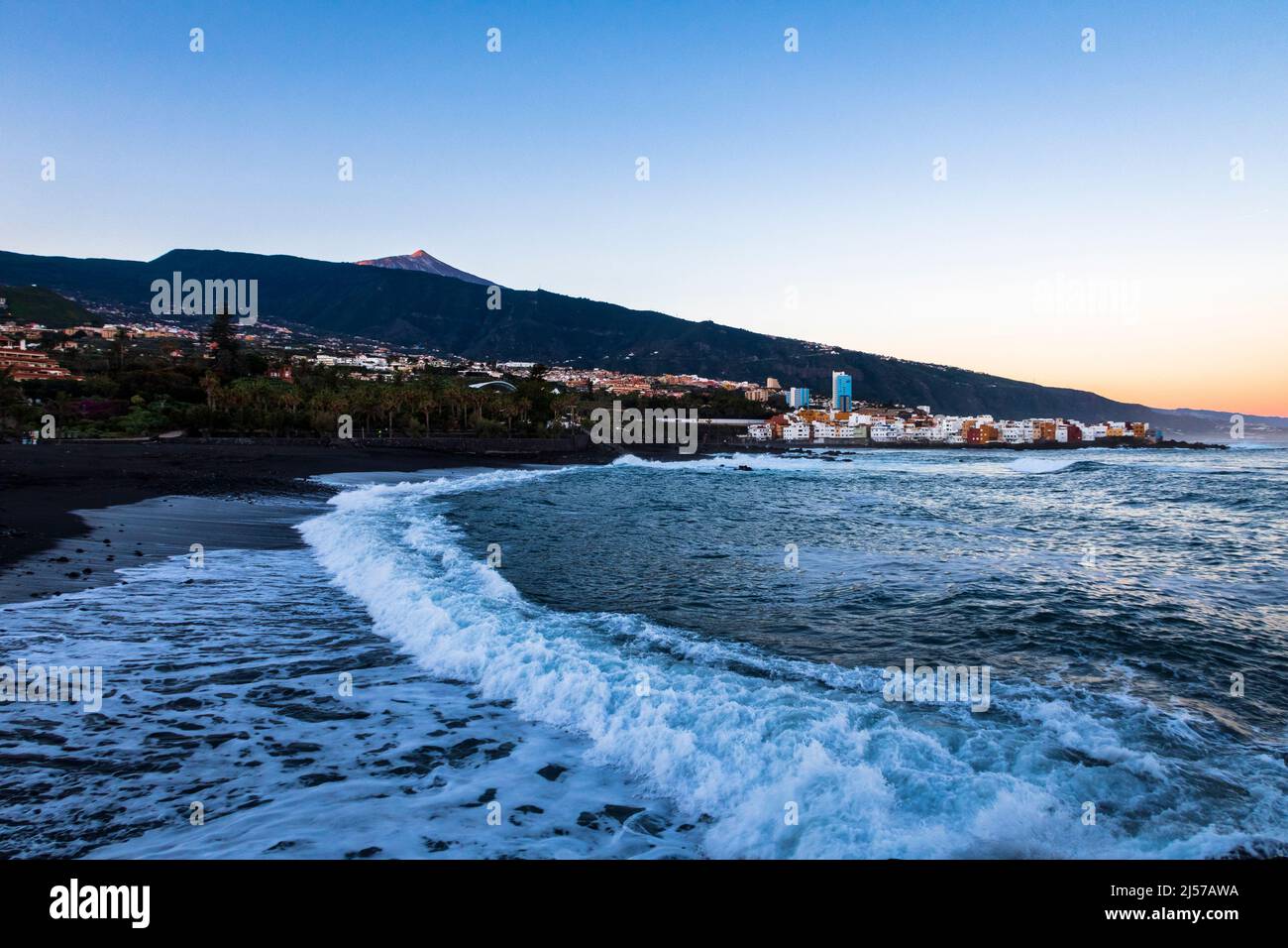 Morning walk along Playa Jardin in the city of Puerto de la Cruz in the north of Tenerife Canary Islands Stock Photo
