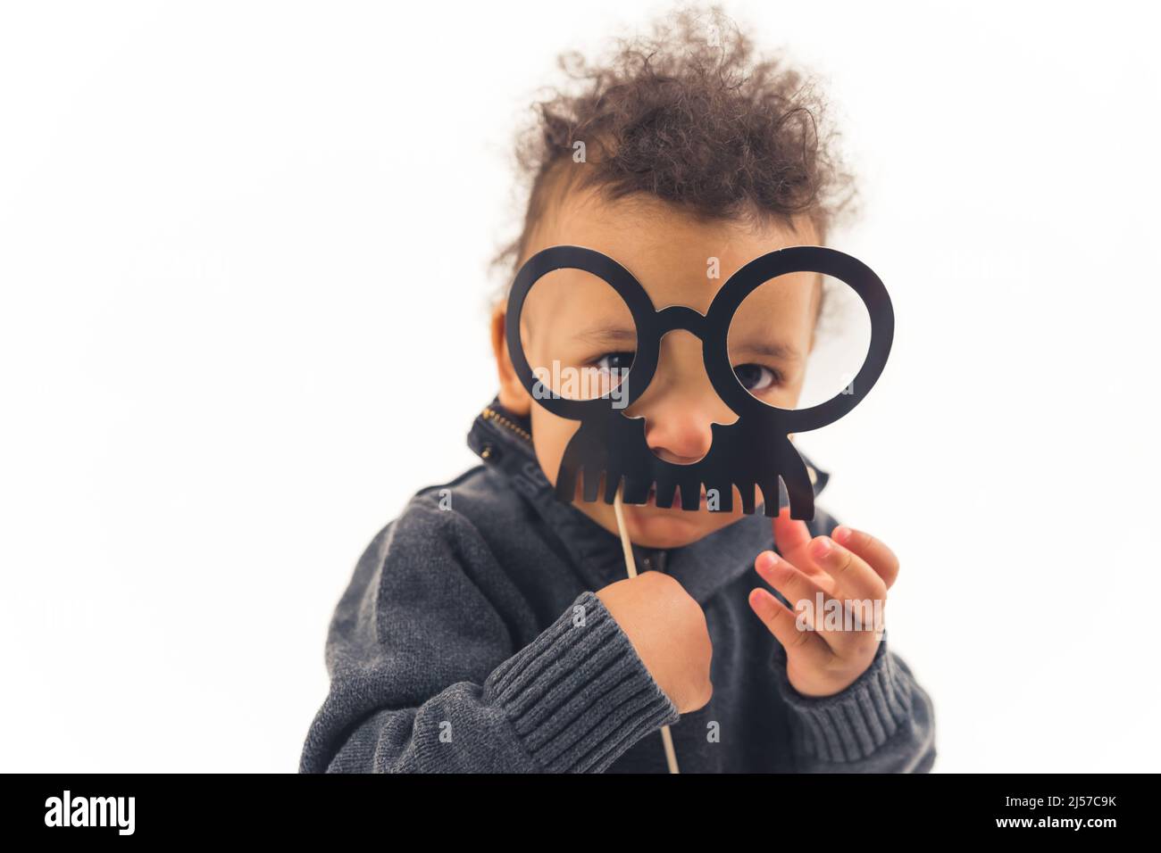 Funny kid with fake mustache, isolated white background. High quality photo Stock Photo