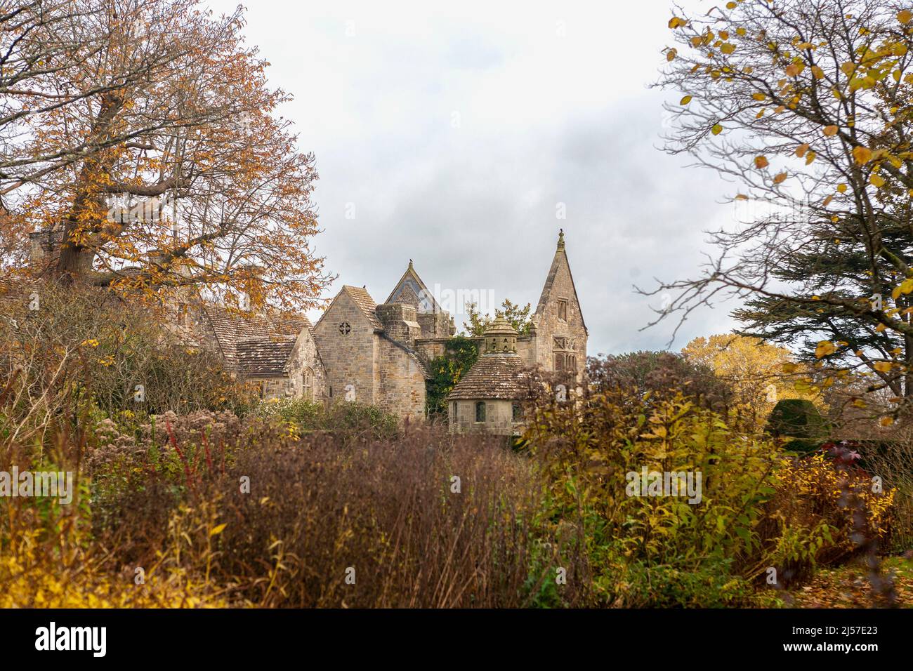Late Autumn at Nymans, with the partly-ruined house framed by trees: Nymans, West Sussex, UK Stock Photo