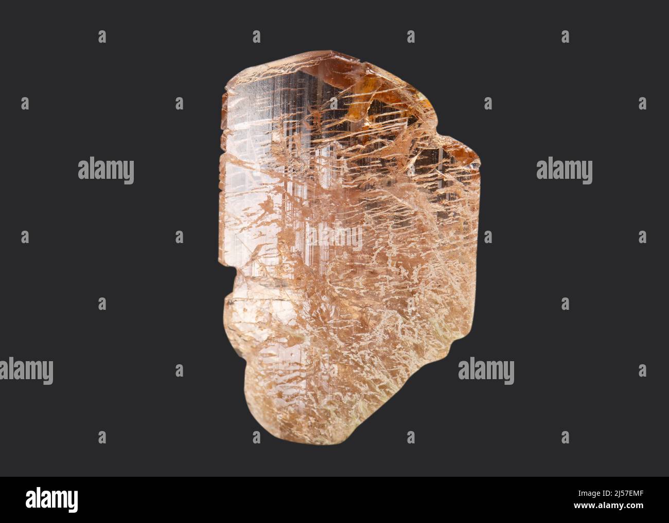 Rock matrix with small crystals and orange and clear topaz with white  background Stock Photo - Alamy