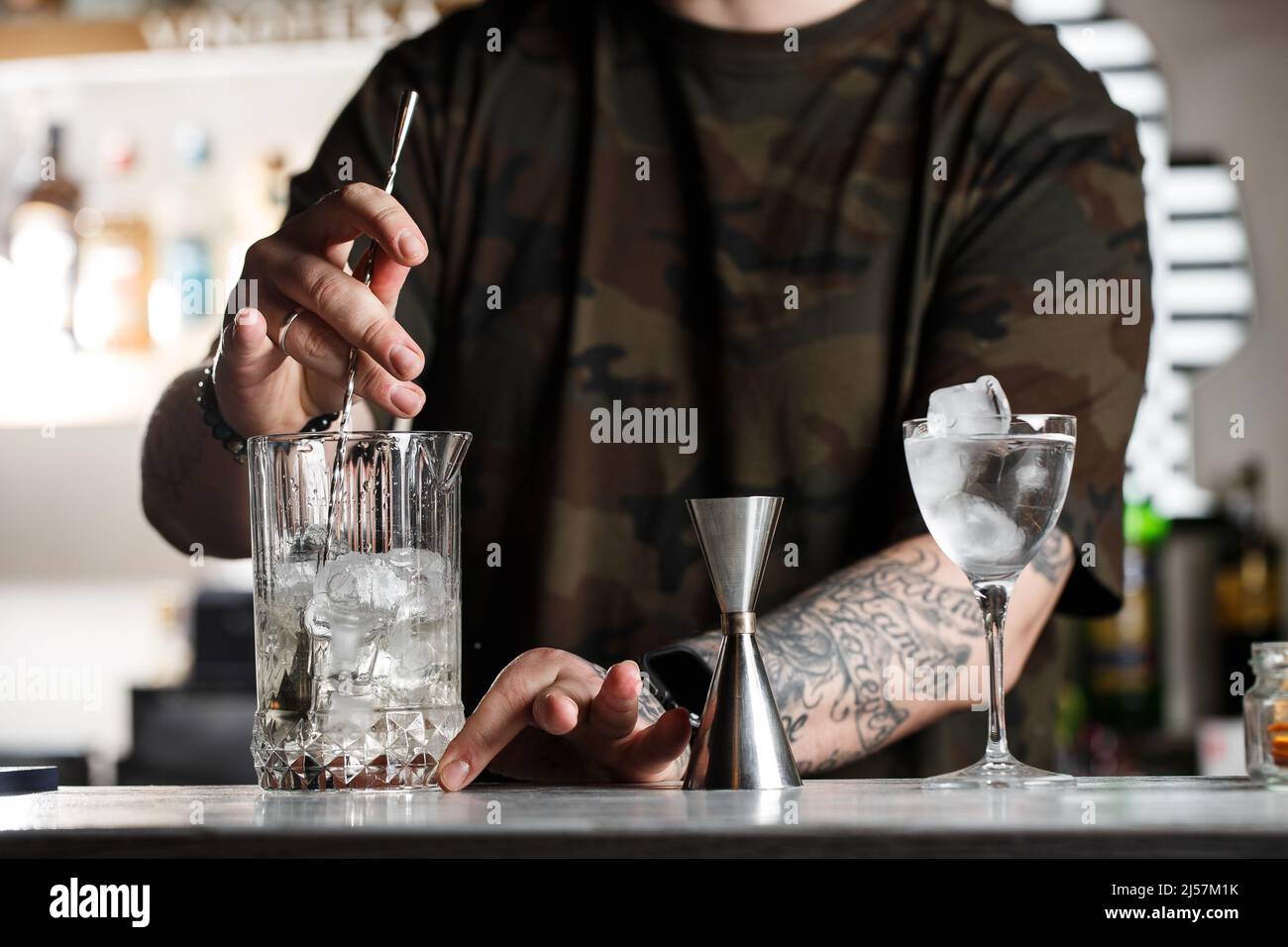 Front View On Wineglass Standing On Bar And Bartender Holding