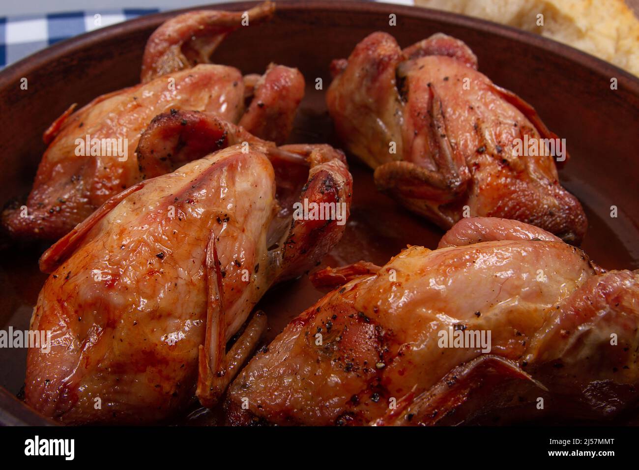 Roasted quail with Golden brown crispy crust. Close-up Stock Photo - Alamy