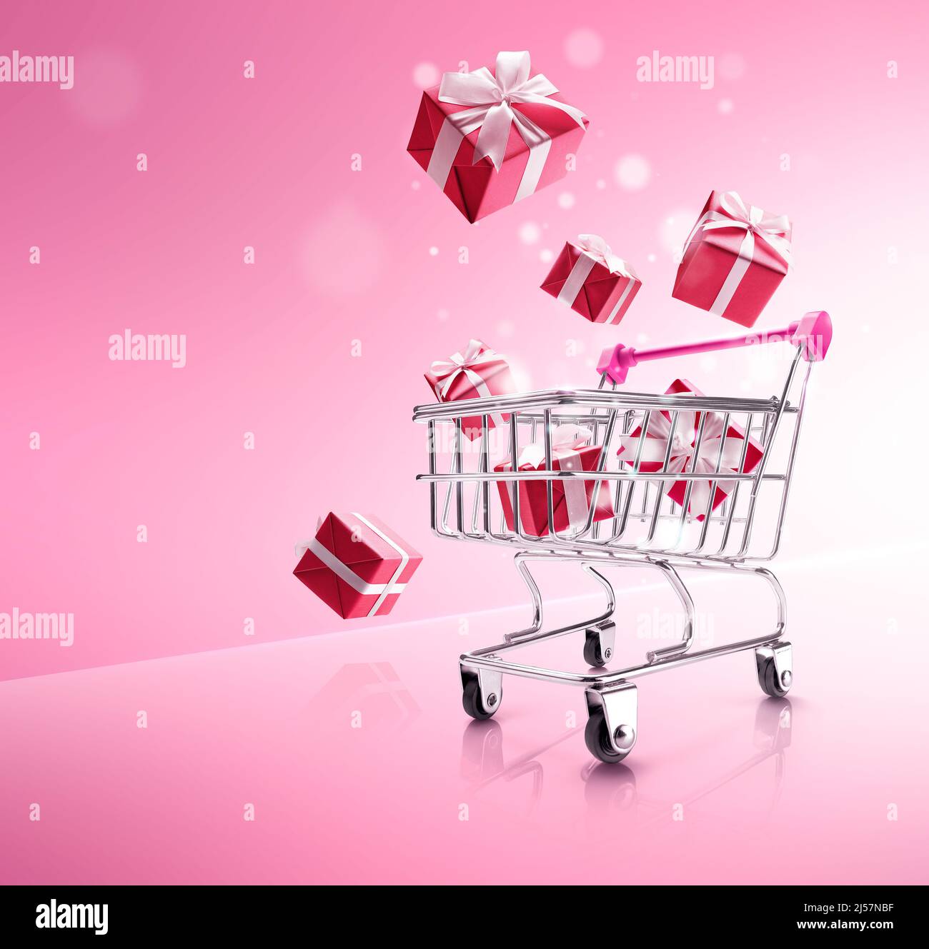 red color gift boxes popping out from shopping cart Stock Photo