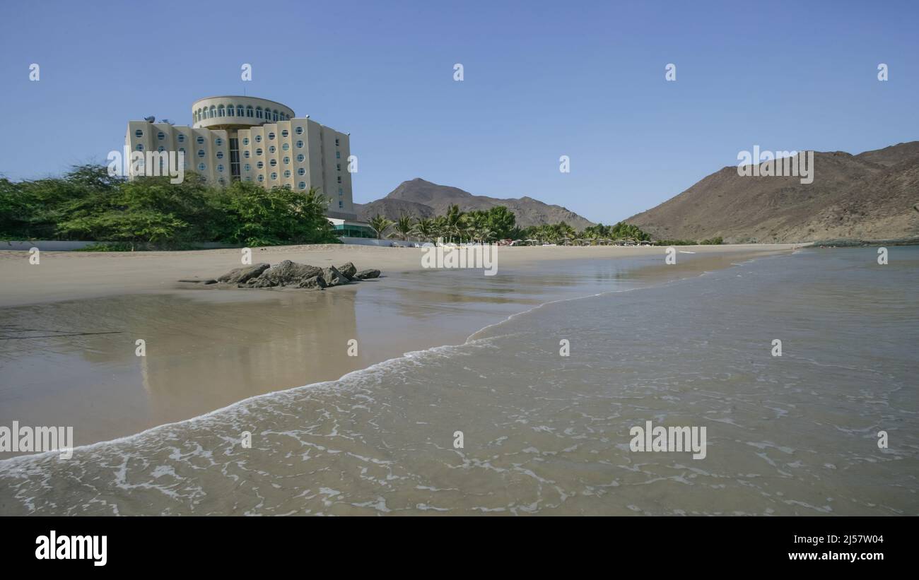 The Oceanic Hotel faces onto the beach in the Emirate of Sharjah's east-coast enclave of Khor Fakkan, in the United Arab Emirates. Stock Photo