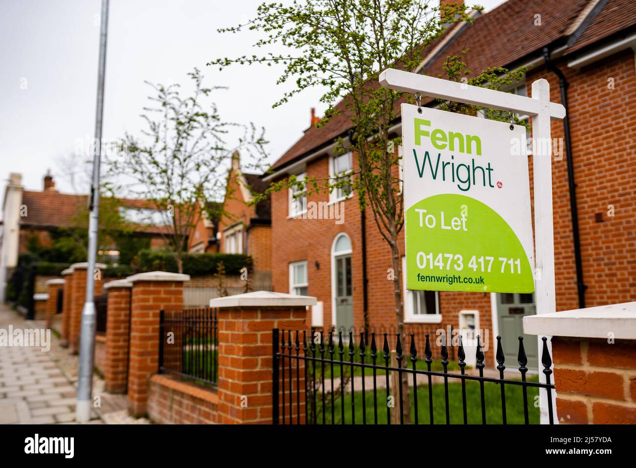 Woodbridge Suffolk UK April 08 2022: A 'to let' sign out side of a newly built modern townhouse advertising that the house in on the market Stock Photo