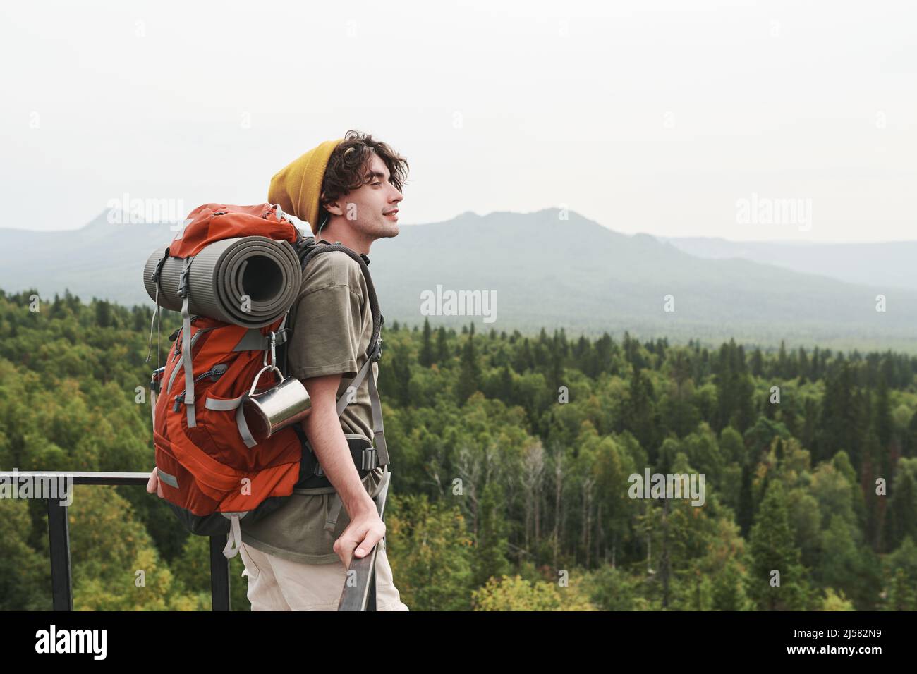 Young hiker in yellow hi-res stock photography and images - Alamy