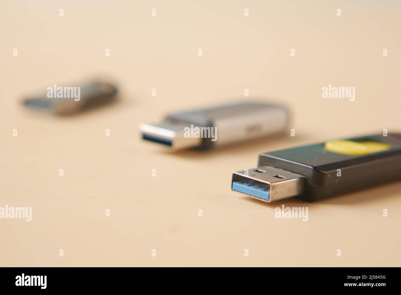 USB flash drive on blue background close up  Stock Photo