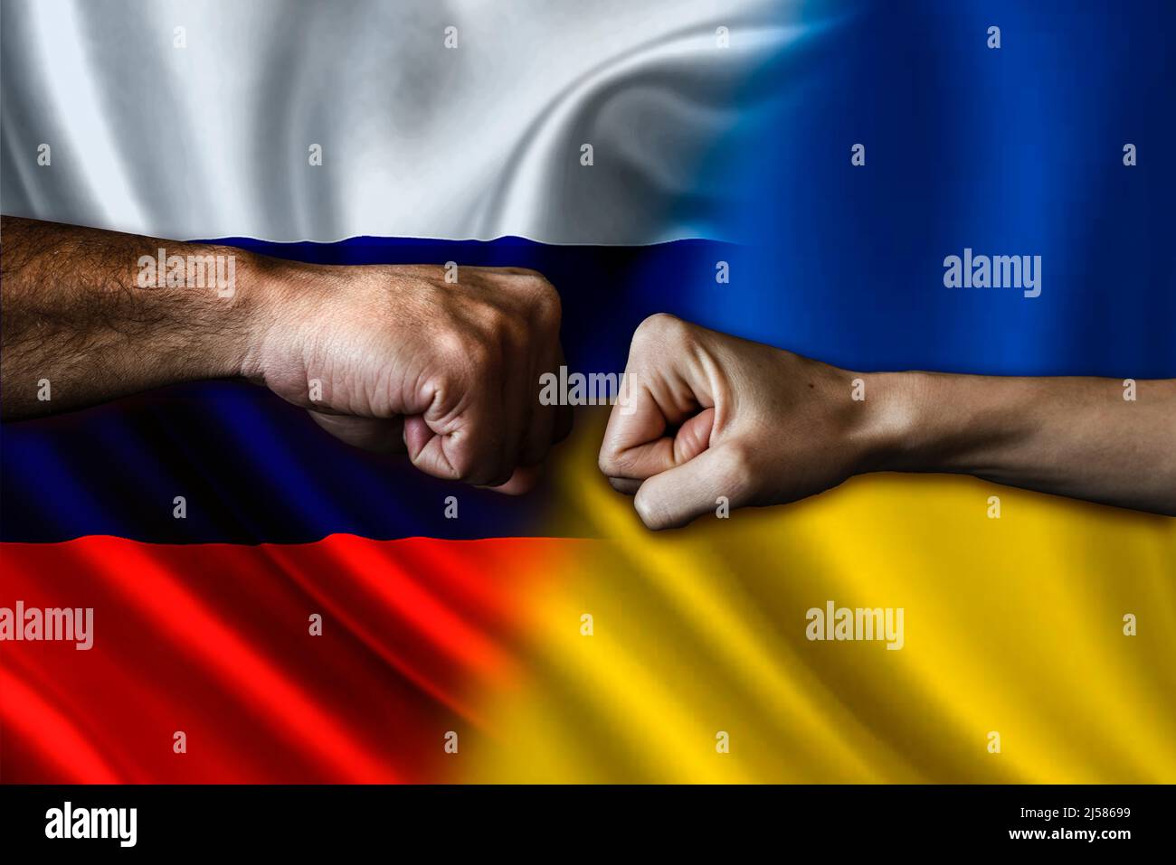 Russia vs Ukraine two fists bumping, Russia vs Ukraine political conflict, Russia vs Ukraine flag, Russia vs Ukraine concept Stock Photo