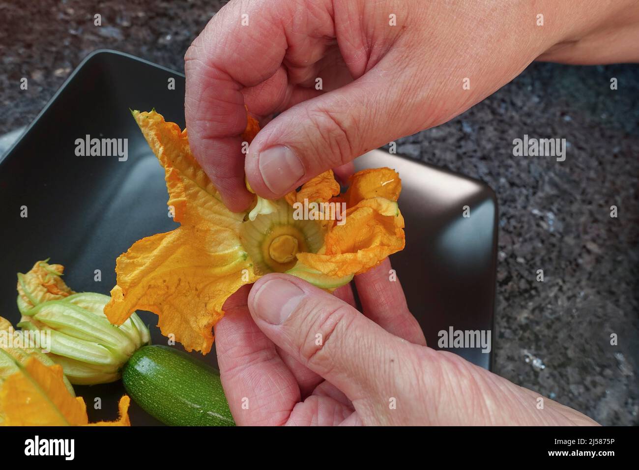 Southern German cuisine, preparing stuffed courgette flowers, removing