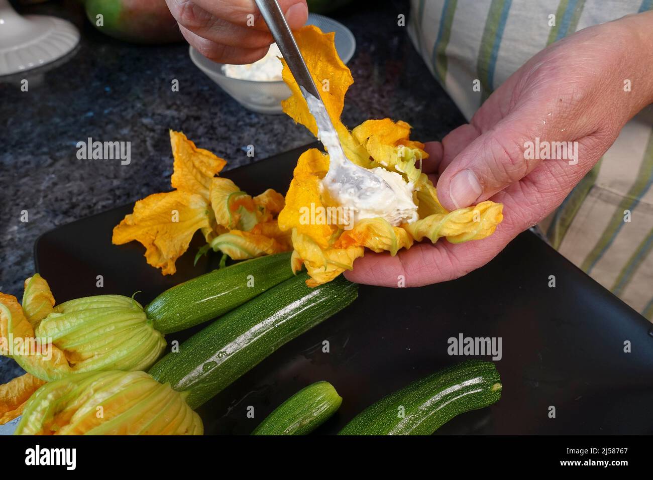 Hand full of courgette hires stock photography and images Alamy