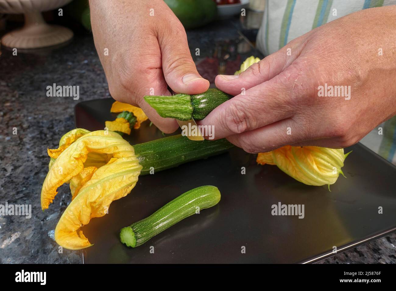 Southern German cuisine, preparing stuffed courgette flowers, cutting ...