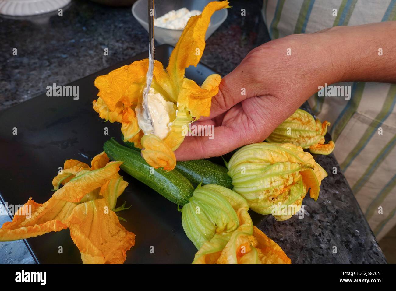 Hand full of courgette hires stock photography and images Alamy