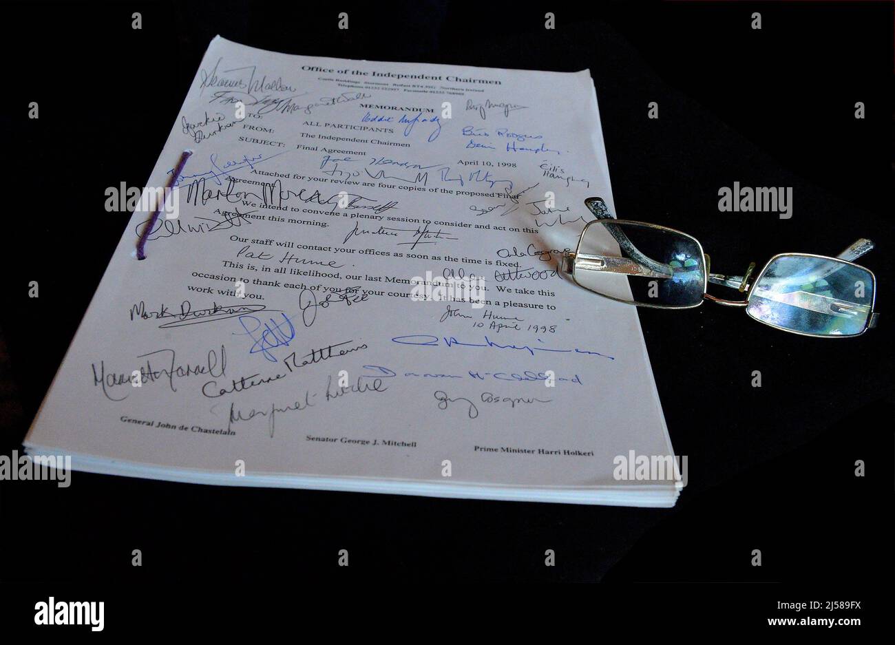 A pair of glasses belonging to John Hume on a copy of the Good Friday Agreement dated April 10 1998 signed by nationalist Social Labour and Democratic (SDLP) negotiators and members. ©George Sweeney / Alamy Stock Photo Stock Photo