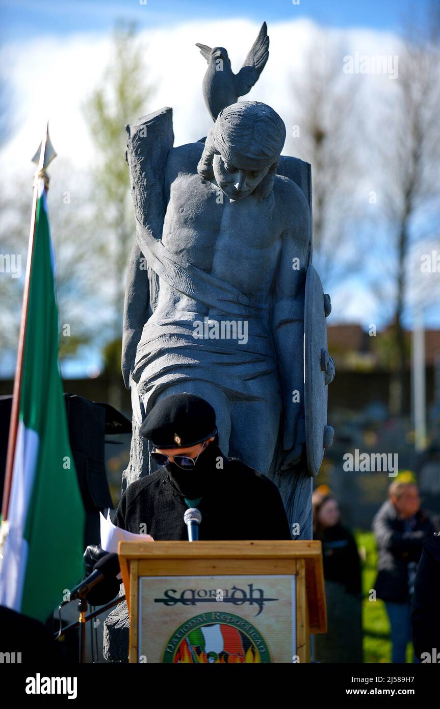 A masked man in paramilitary uniform reads a statement at an Easter Monday Dissident Republican parade in Derry, Northern Ireland 18 March 2022. ©George Sweeney / Alamy Stock Photo Stock Photo