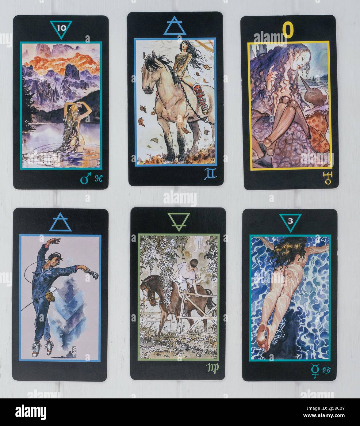 Six cards from deck of Manara Tarot lie face up on white surface. Divination, predictions, fate concept. Tarot spread. Minsk, Belarus, 28.07.2021 Stock Photo