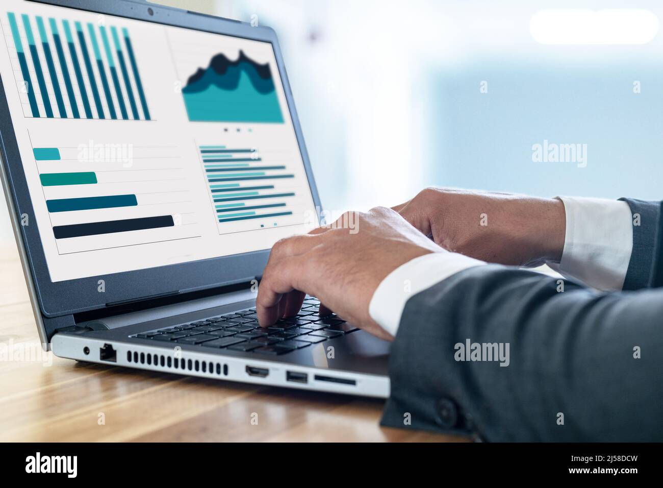 Close up photo of businessman using laptop and computer. Concept of