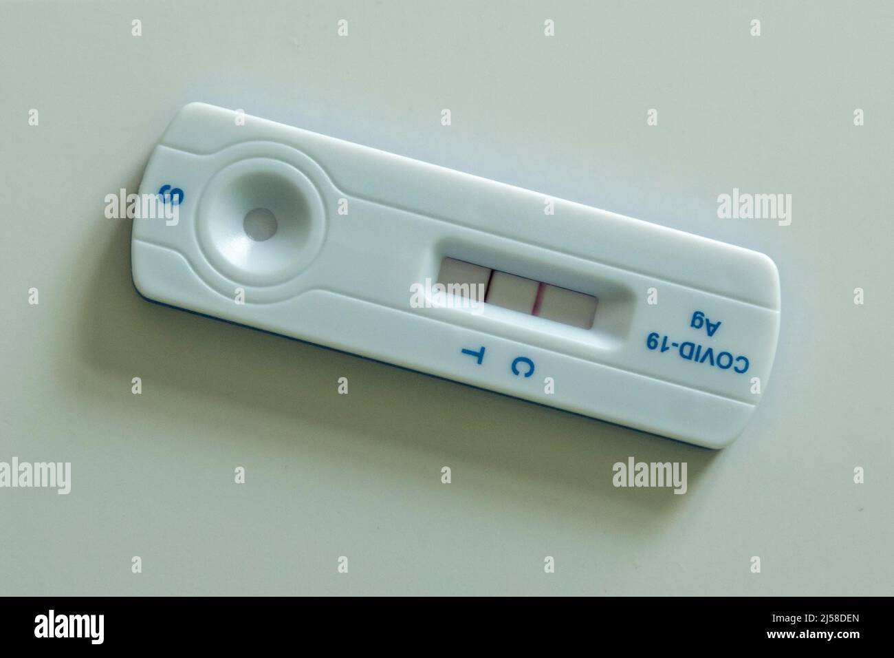 Covid-19 antigen test cassette shows positive result, Germany Stock ...