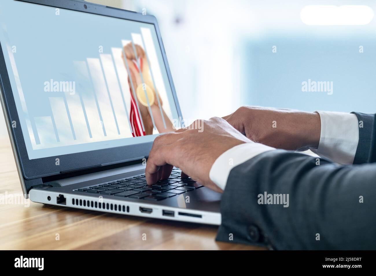 Businesswoman holding golden medal with rising chart double exposure and screen mockup. Concept of success of startup business or earning and  profit Stock Photo