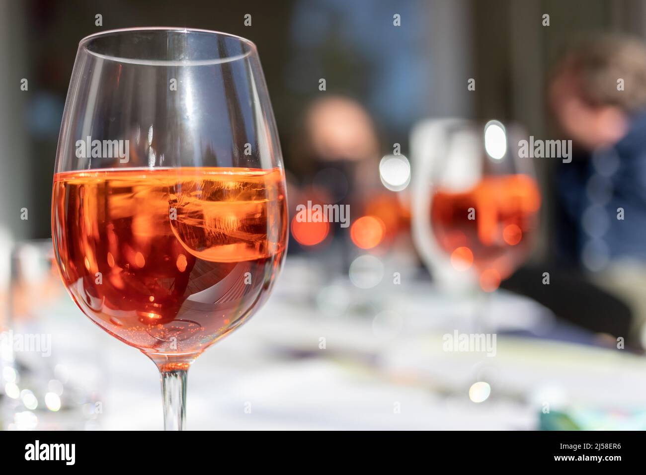 glass with reddish aperitif on ice Stock Photo