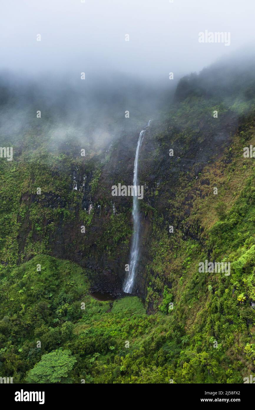 Waterfalls drop hundreds of feet down the face of Wai'ale'ale, one of