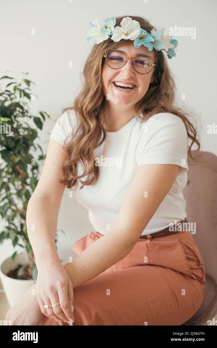 young artisanal artist wearing her handmade flower headband Stock Photo