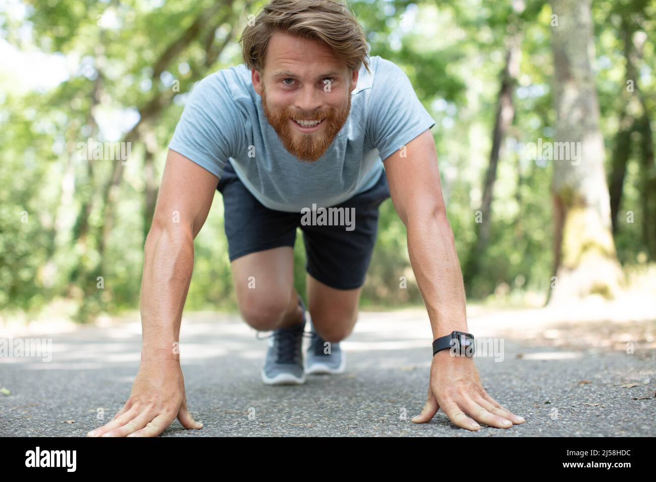 young sportsman is ready to run outdoors in the morning Stock Photo