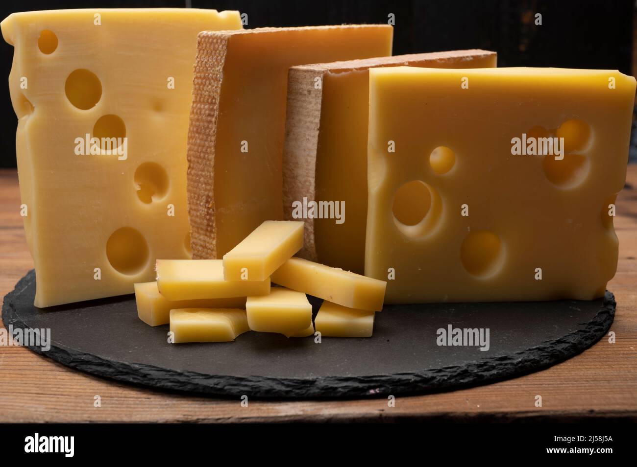 Swiss cheese collection, emmentaler with holes, gruyere, appenzeller