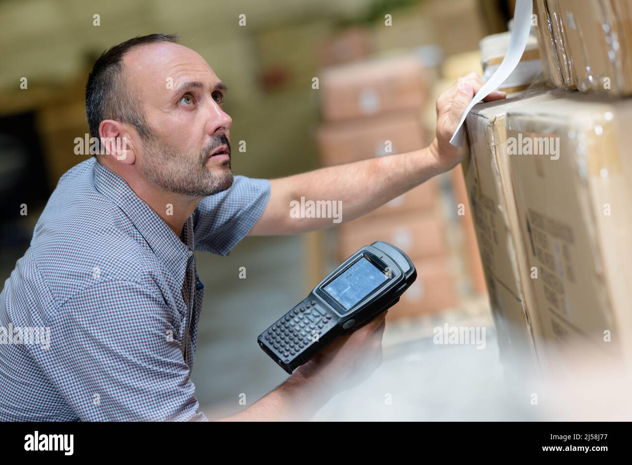 worker with portable barcode scanner in warehouse Stock Photo Alamy