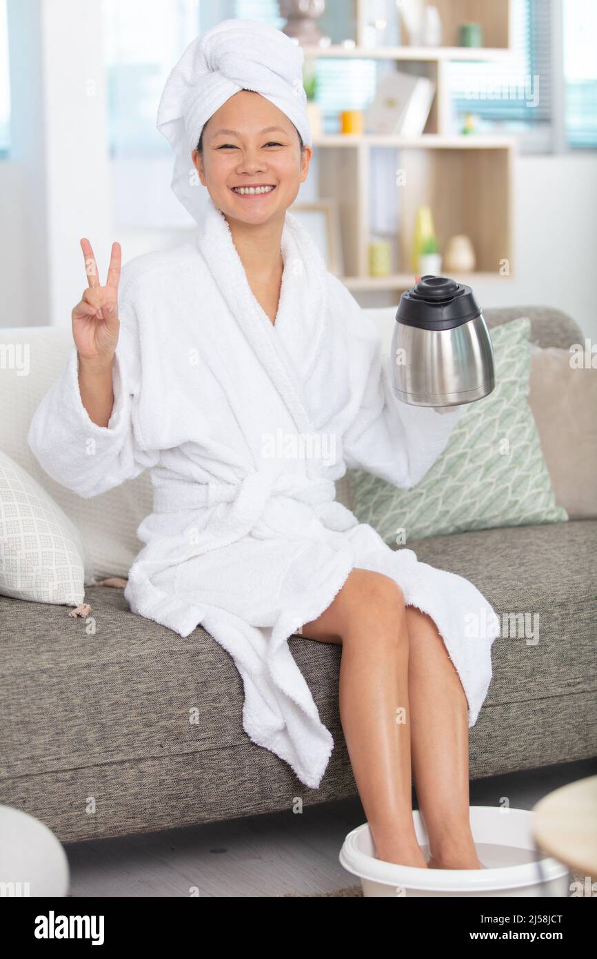 happy woman having a footbath Stock Photo
