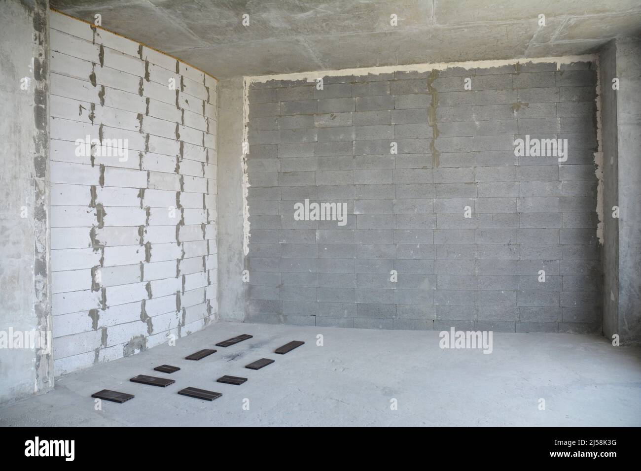 Interior room under construction. Wall without stucco and plasterwork ...