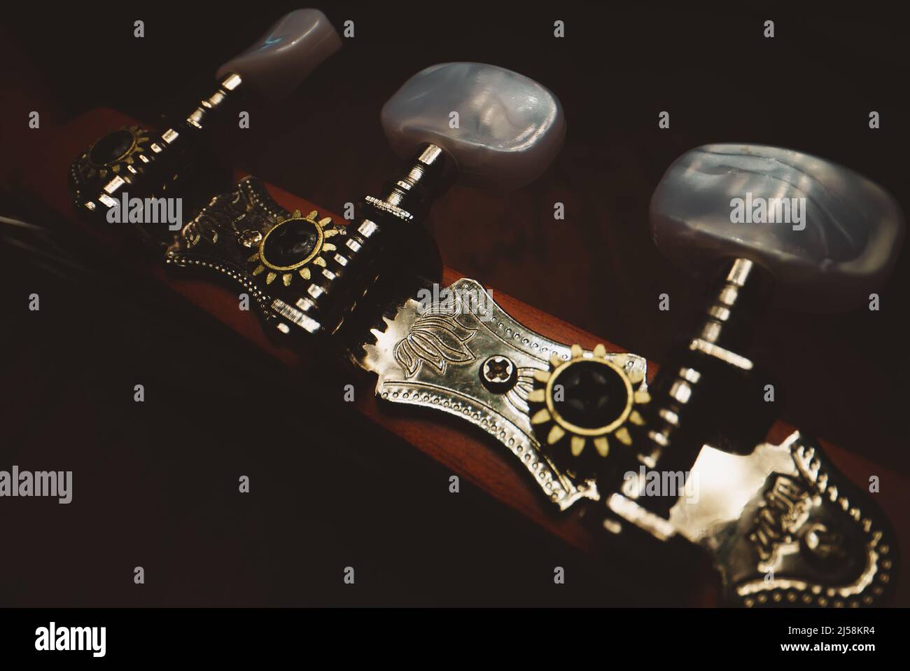 Guitar pegs on a six-string Spanish guitar. Stock Photo