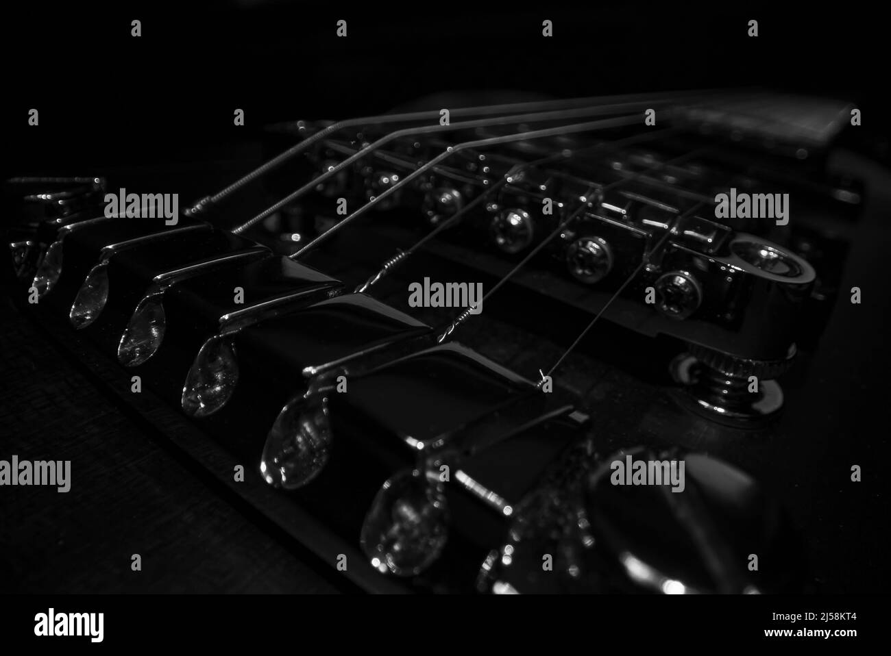 Six-string electric guitar bridge and saddle. Stock Photo