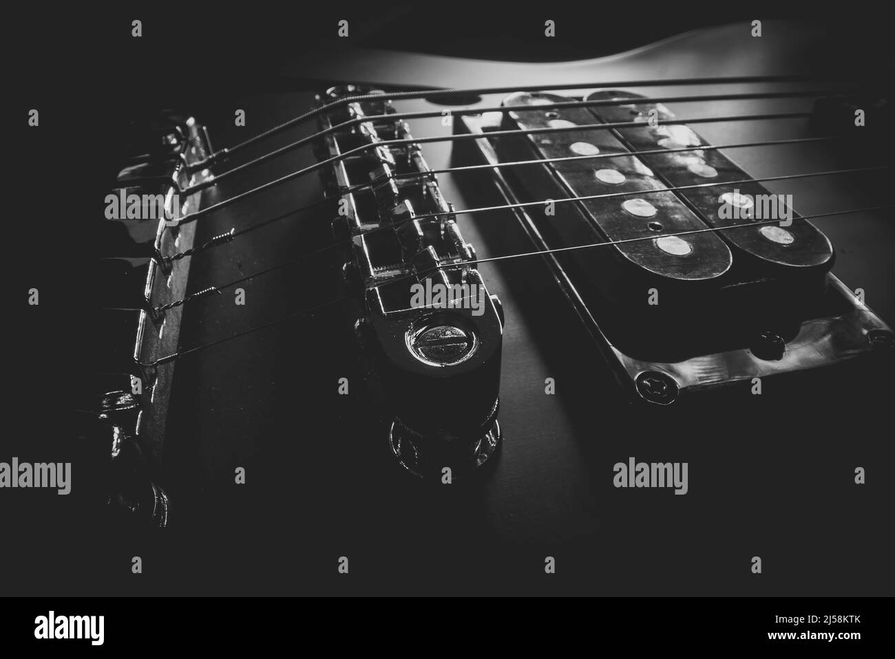 Sixstring electric guitar bridge and saddle Stock Photo Alamy